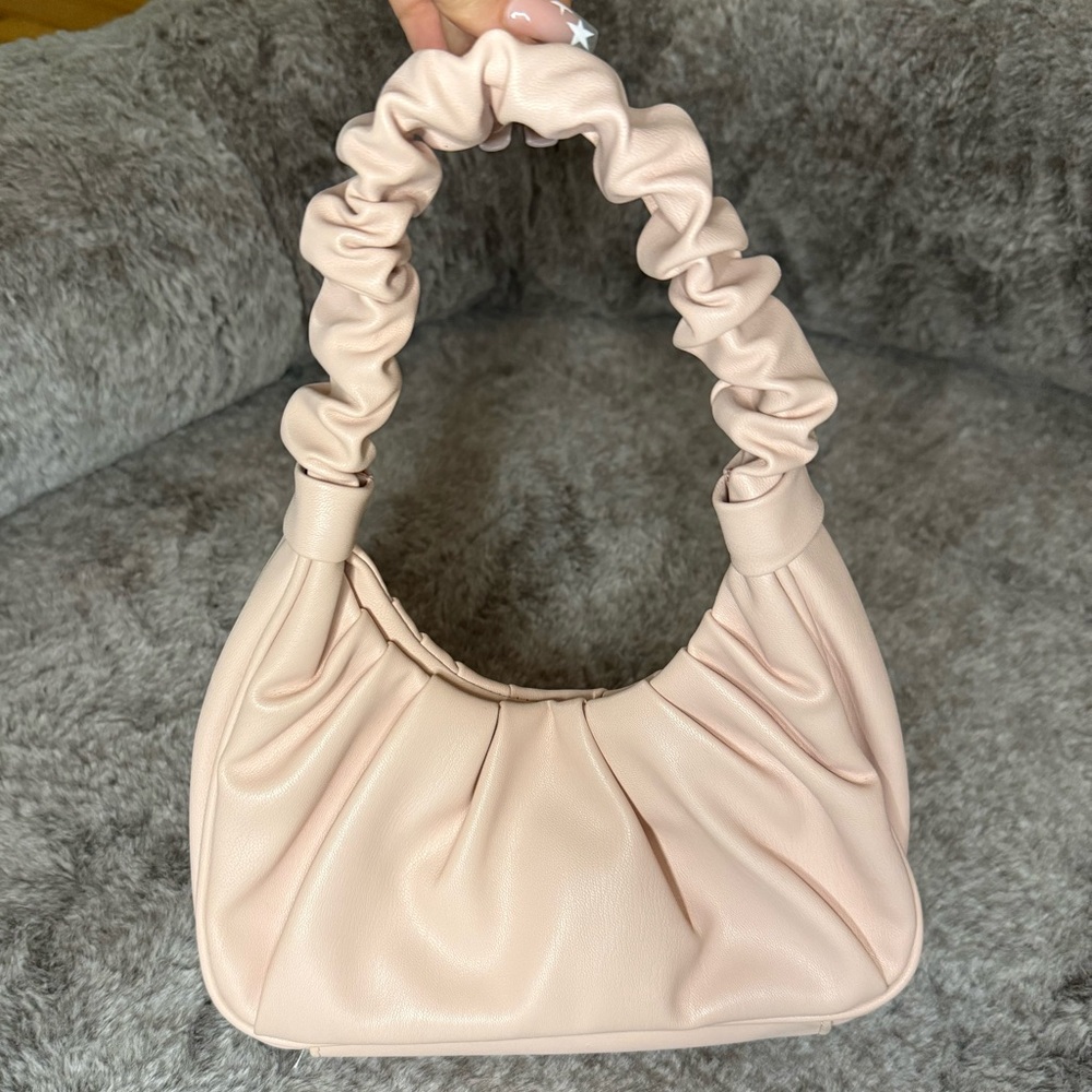 Light pink ruffled purse